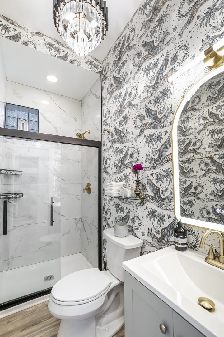 1413 North Campbell Avenue, Unit 1 Chicago, IL 60622 - Photo 13 of 20 a bathroom with a sink a toilet and shower