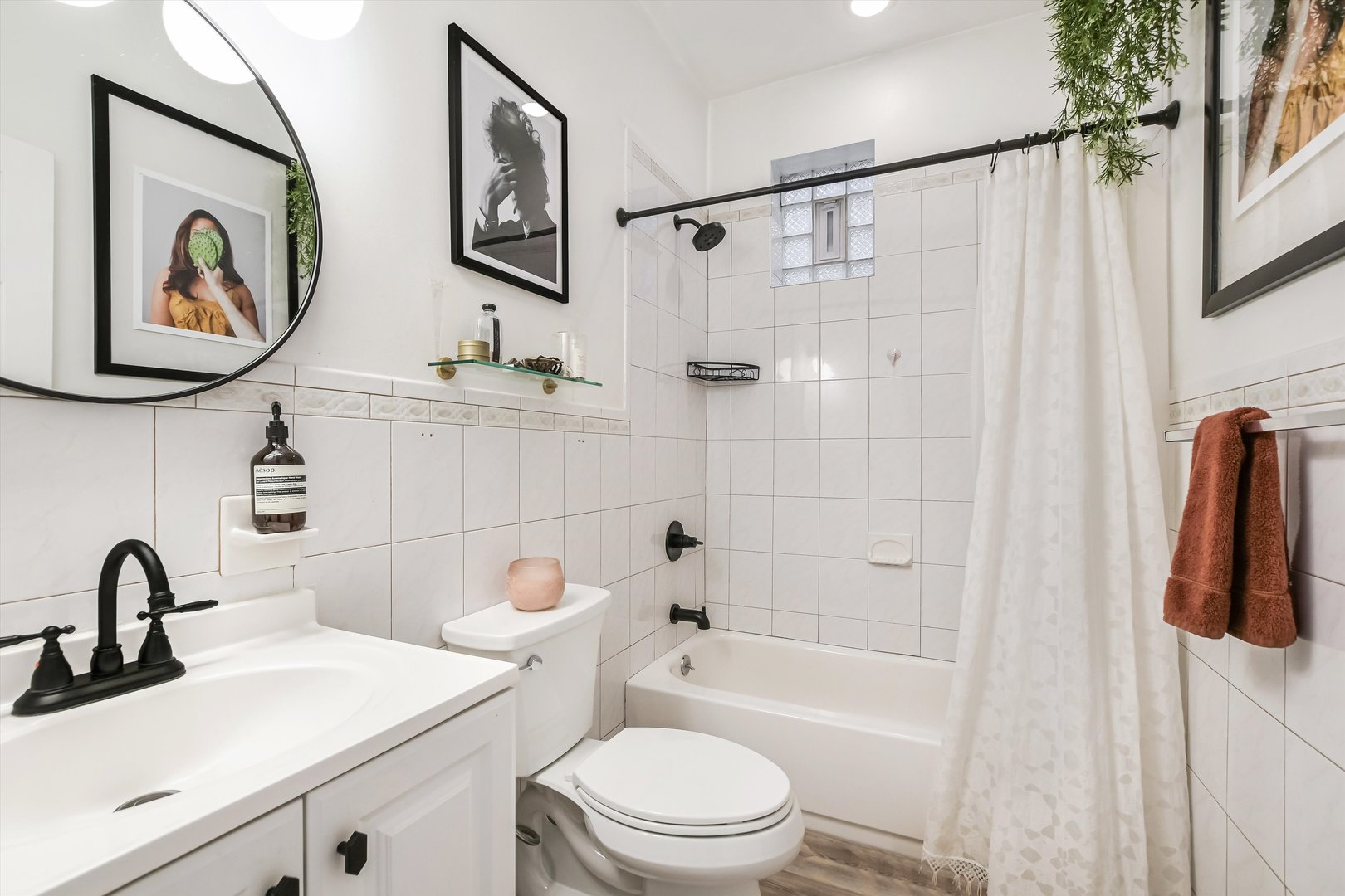 1413 North Campbell Avenue, Unit 1 Chicago, IL 60622 - Photo 16 of 20 a bathroom with a toilet sink and mirror