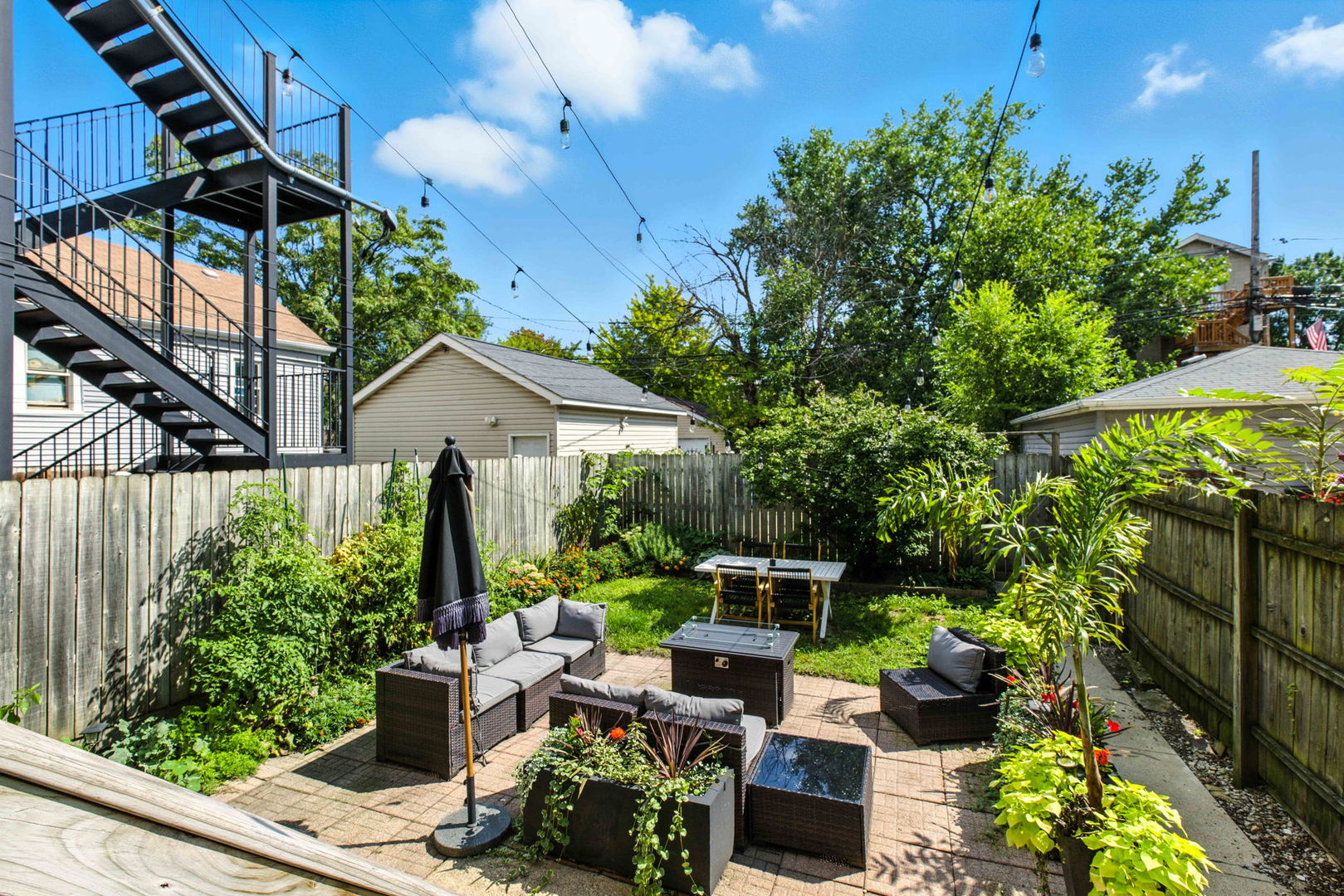 1413 North Campbell Avenue, Unit 1 Chicago, IL 60622 - Photo 20 of 20 a view of backyard with plants and outdoor seating