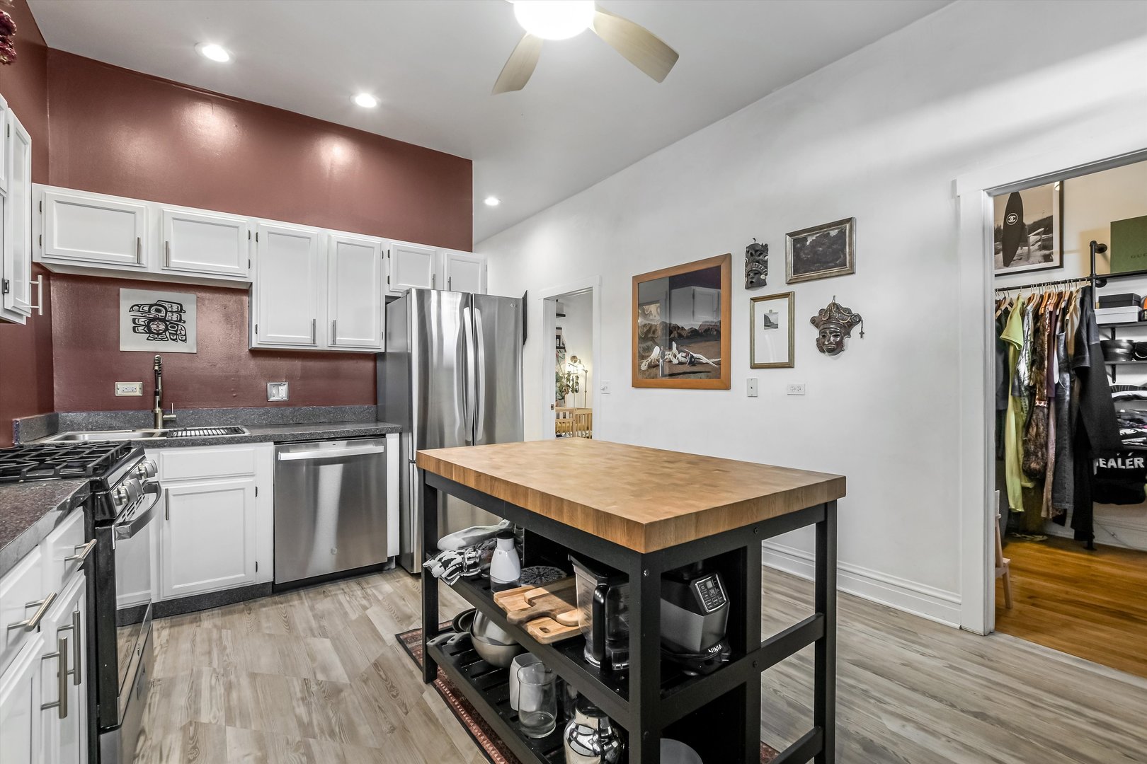 1413 North Campbell Avenue, Unit 1 Chicago, IL 60622 - Photo 10 of 20 a kitchen with stainless steel appliances granite countertop a stove refrigerator sink and cabinets