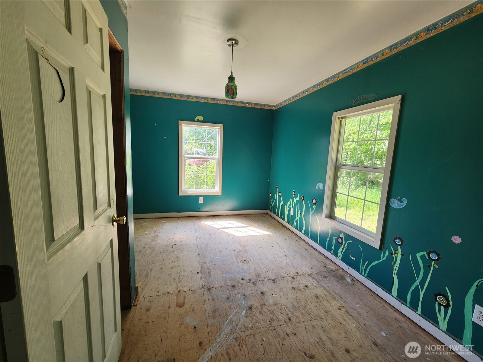 175 Stevens Road Chehalis, WA 98532 - Photo 16 of 20 a view of an empty room with a window and a kitchen