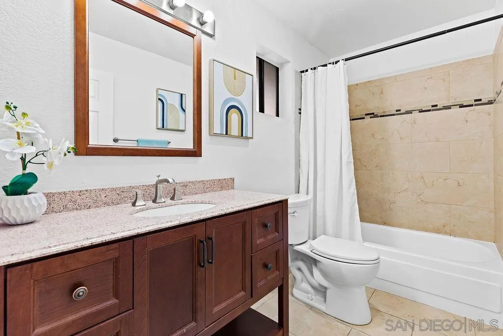 2157 Arnold Way, Unit 324 Alpine, CA 91901 - Photo 11 of 31 a bathroom with a granite countertop sink toilet and shower