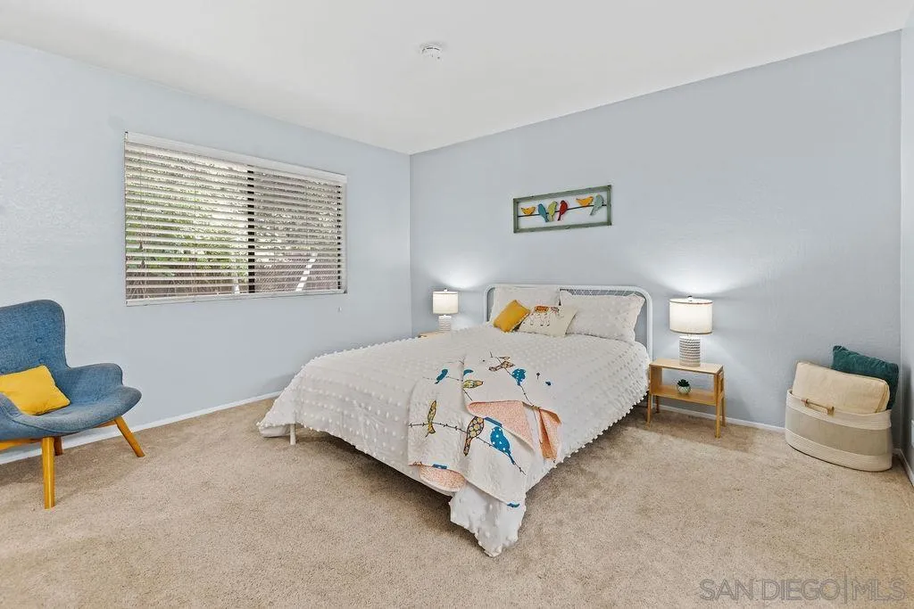 2157 Arnold Way, Unit 324 Alpine, CA 91901 - Photo 12 of 31 a bedroom with a bed and a window