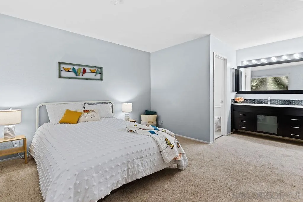 2157 Arnold Way, Unit 324 Alpine, CA 91901 - Photo 15 of 31 a bedroom with a bed and a fireplace