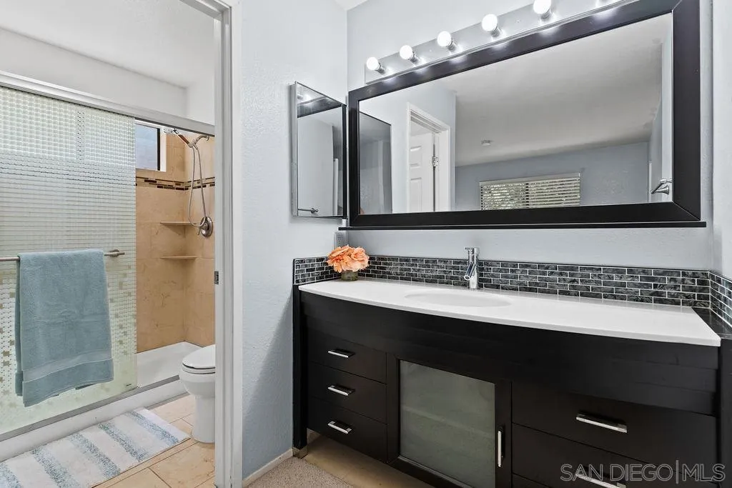 2157 Arnold Way, Unit 324 Alpine, CA 91901 - Photo 18 of 31 a bathroom with a sink and a mirror