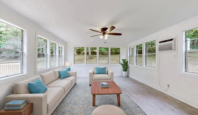 a living room with furniture and a large window