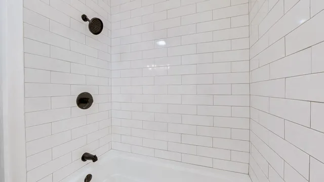 a bathroom with a sink a vanity a shower and a mirror