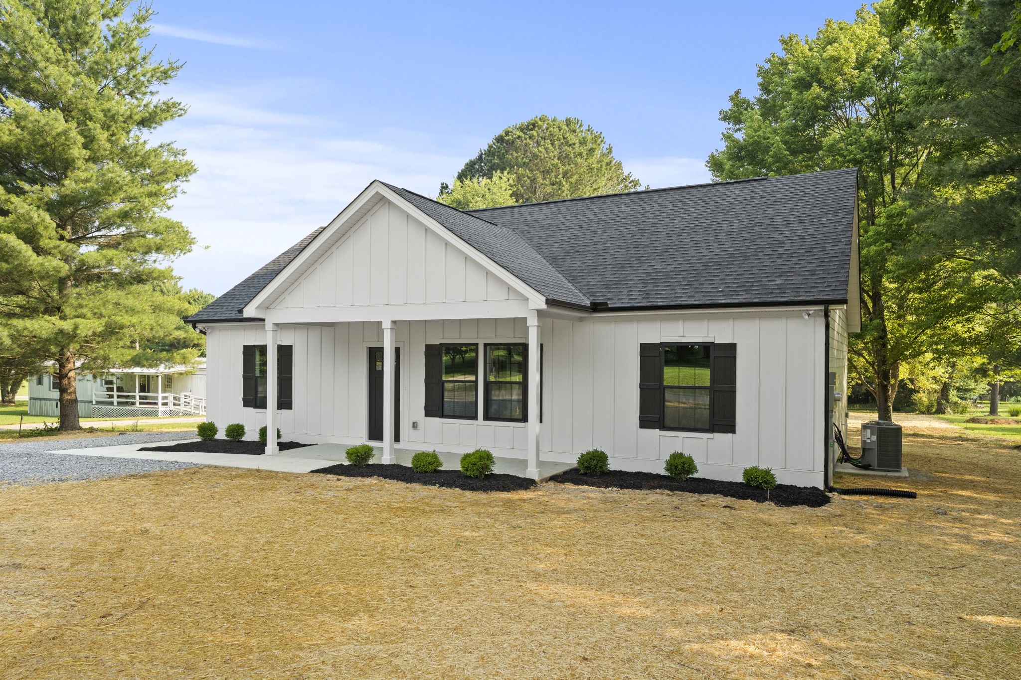 204 Point Road Portland, TN 37148 - Photo 2 of 51 a front view of a house with a yard