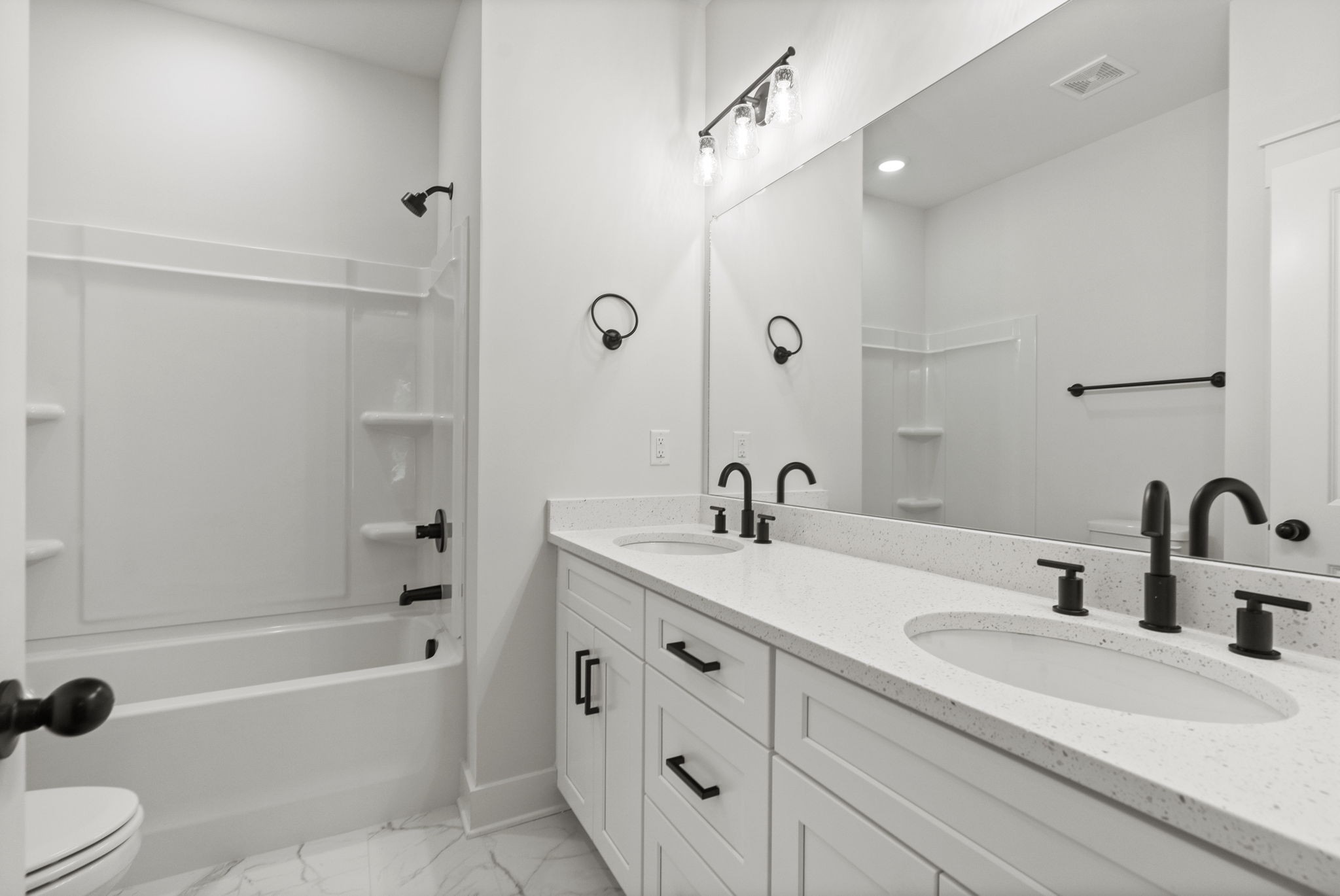 204 Point Road Portland, TN 37148 - Photo 27 of 51 a bathroom with a sink double vanity granite tub shower and mirror