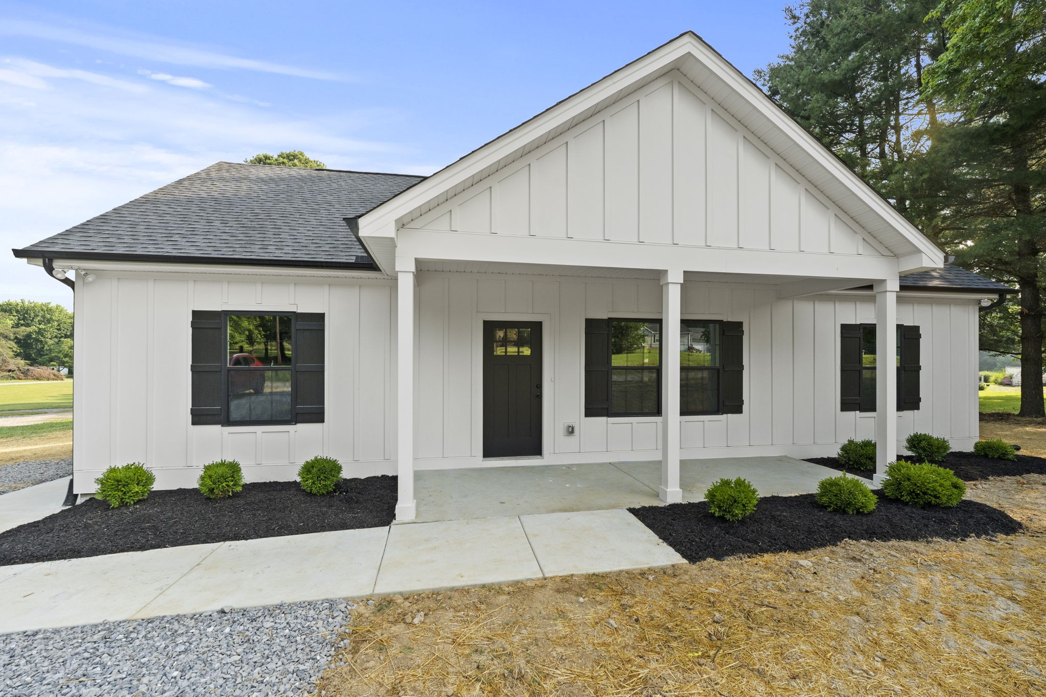 204 Point Road Portland, TN 37148 - Photo 4 of 51 a front view of a house with garden