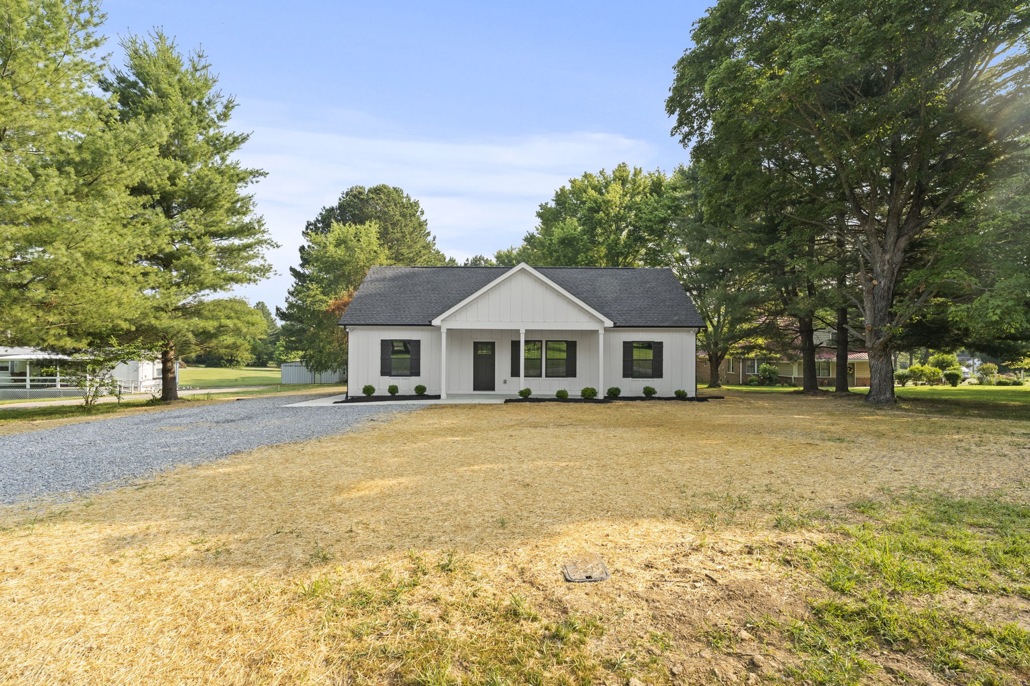 204 Point Road Portland, TN 37148 - Photo 5 of 51 a front view of a house with a garden