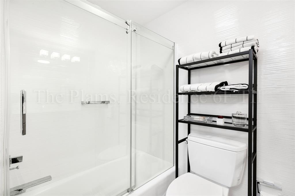 2110 North Ocean Boulevard, Unit 6F Fort Lauderdale, FL 33305 - Photo 27 of 51 a bathroom with a shower toilet and tub