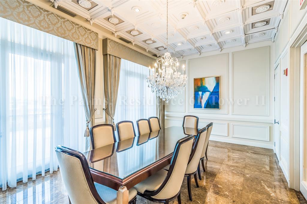 2110 North Ocean Boulevard, Unit 6F Fort Lauderdale, FL 33305 - Photo 38 of 51 a view of a dining room with furniture and chandelier