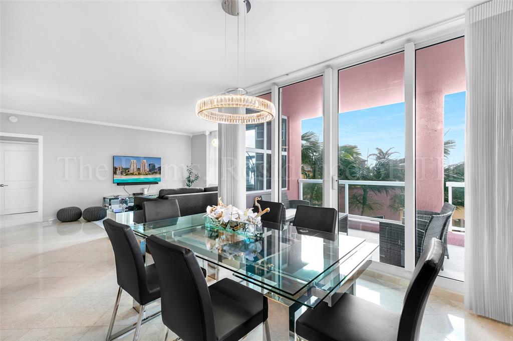 2110 North Ocean Boulevard, Unit 6F Fort Lauderdale, FL 33305 - Photo 8 of 51 a view of a dining room with furniture large window and wooden floor