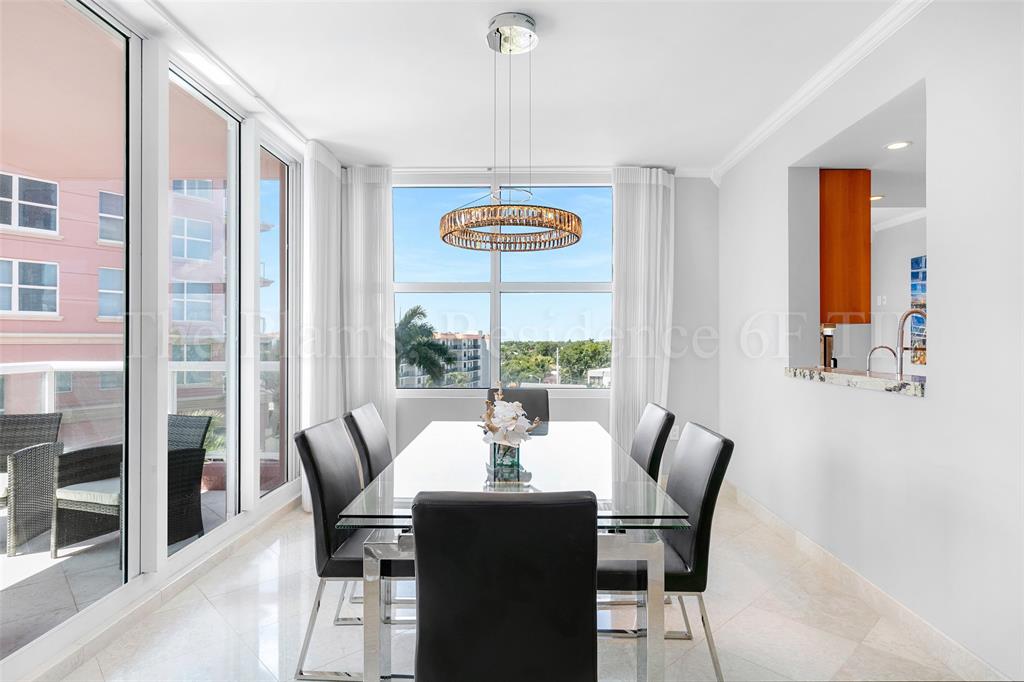 2110 North Ocean Boulevard, Unit 6F Fort Lauderdale, FL 33305 - Photo 10 of 51 a dining room with furniture a chandelier and wooden floor