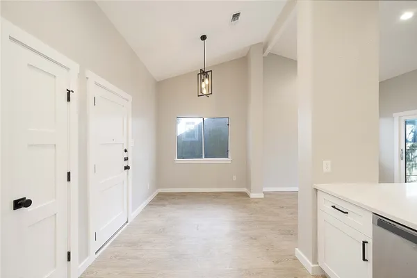 a view of a hallway with closet