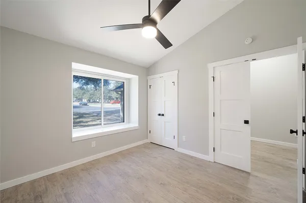 a view of an empty room with a window