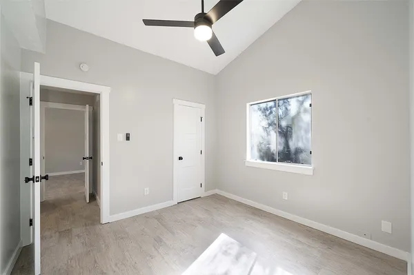 a view of an empty room with a window