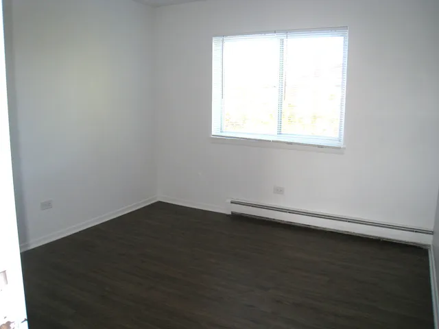 a view of small space with wooden floor