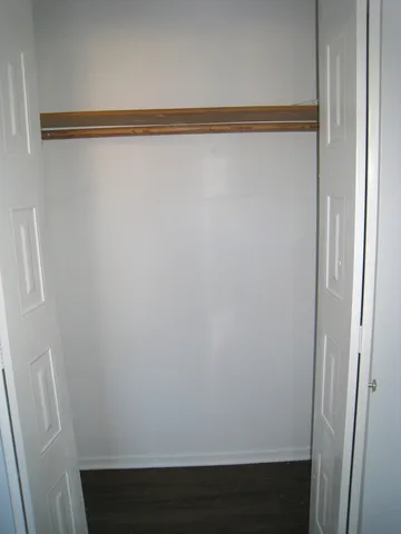 a bathroom with a sink toilet vanity and a mirror