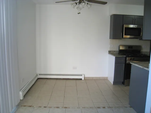 a view of kitchen with a sink and a stove top oven