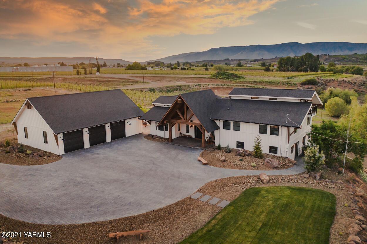 491 Elliott Road Cowiche, WA 98923 - Photo 1 of 49 an aerial view of a house with swimming pool and ocean view