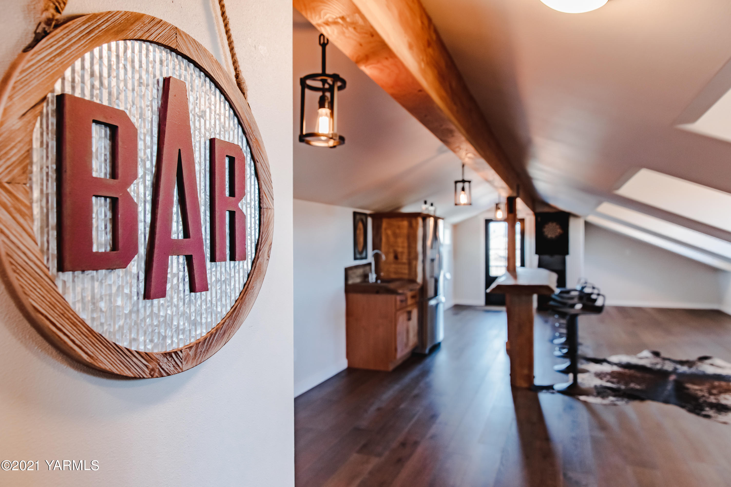 491 Elliott Road Cowiche, WA 98923 - Photo 22 of 49 a view of a livingroom with wooden floor and staircase