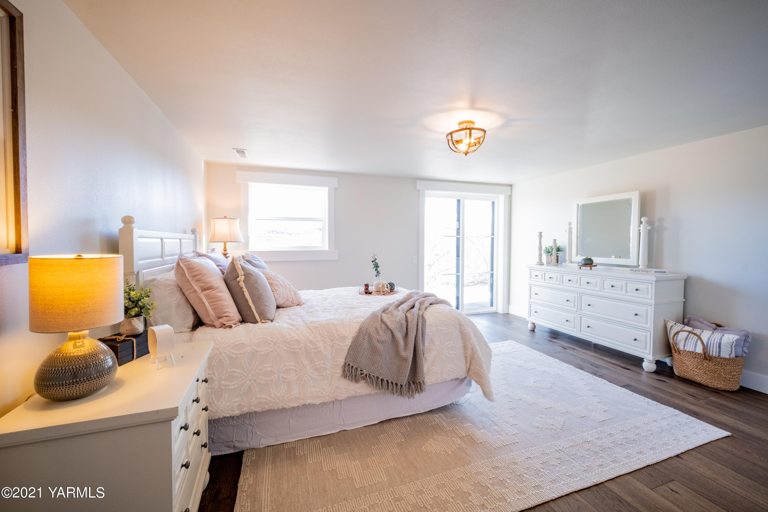 491 Elliott Road Cowiche, WA 98923 - Photo 26 of 49 a bedroom with a bed and wooden floor