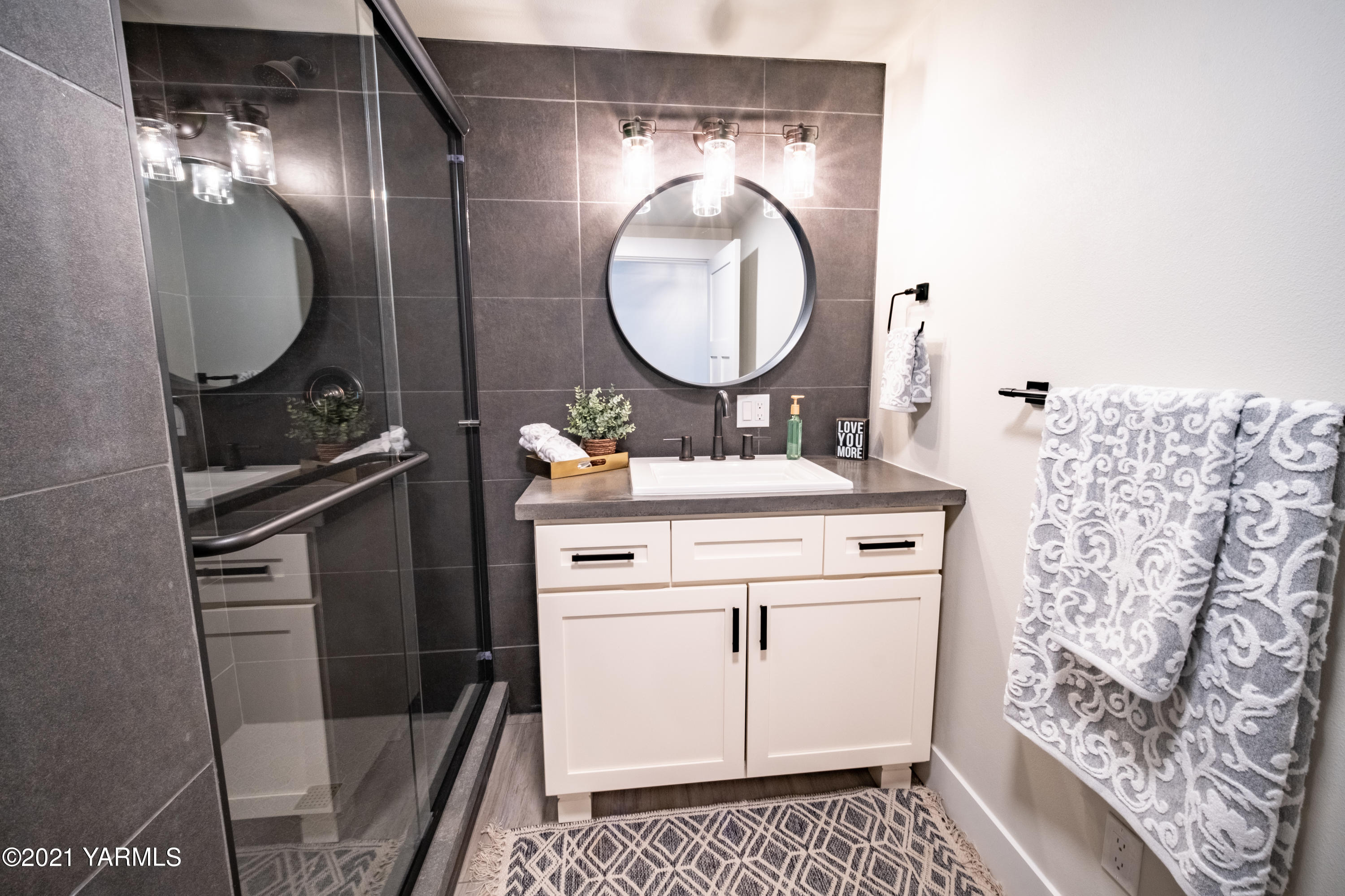 491 Elliott Road Cowiche, WA 98923 - Photo 32 of 49 a bathroom with a sink a mirror and a toilet