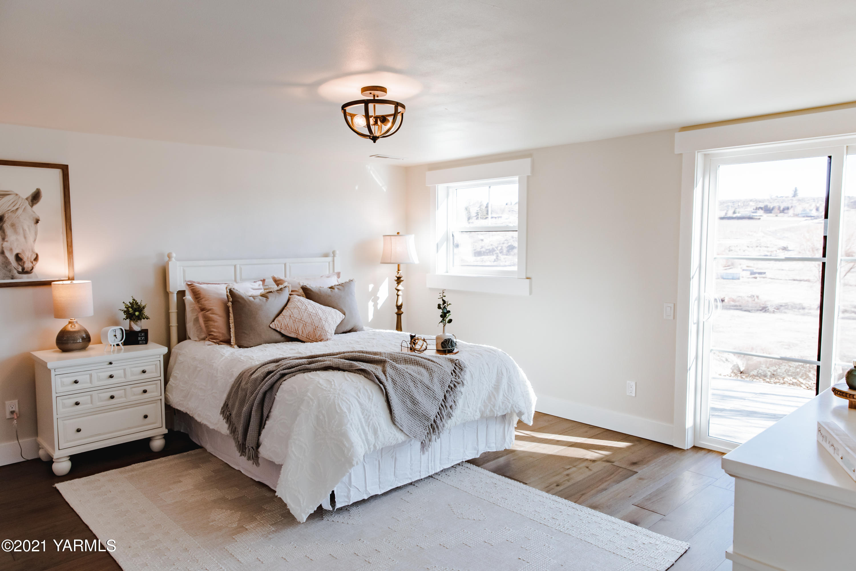 491 Elliott Road Cowiche, WA 98923 - Photo 34 of 49 a spacious bedroom with a bed and a window