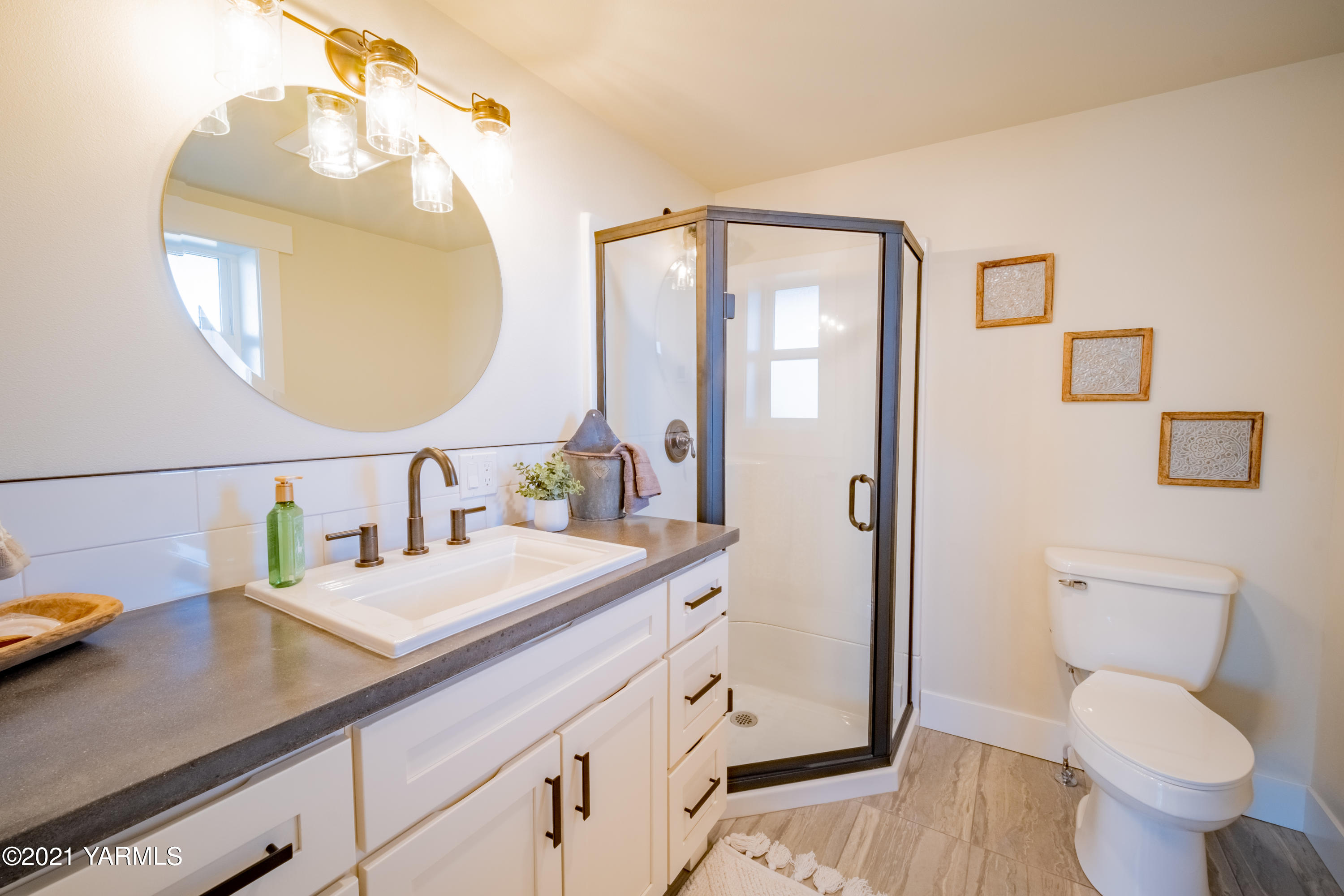491 Elliott Road Cowiche, WA 98923 - Photo 37 of 49 a bathroom with a granite countertop sink mirror and toilet
