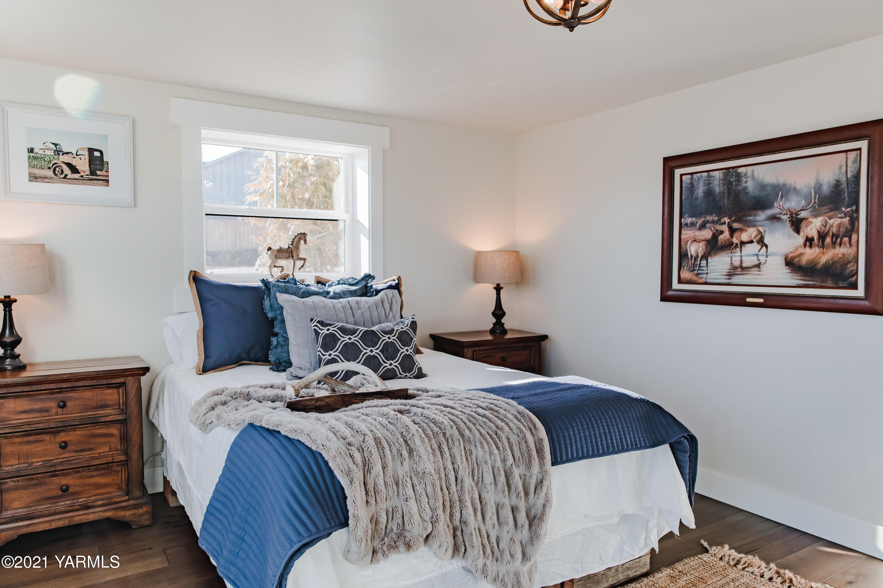 491 Elliott Road Cowiche, WA 98923 - Photo 38 of 49 a bedroom with a bed and a painting on the wall