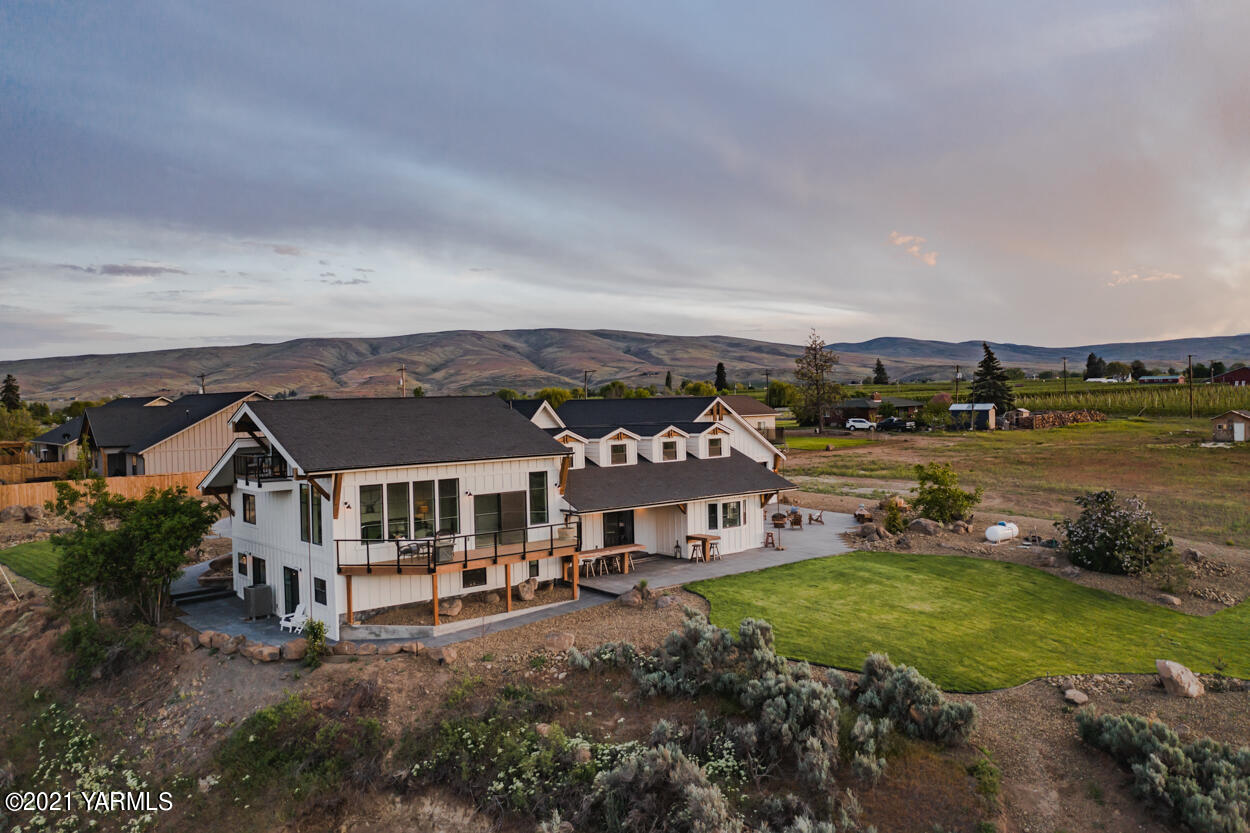 491 Elliott Road Cowiche, WA 98923 - Photo 42 of 49 an aerial view of a house with garden space and a street view