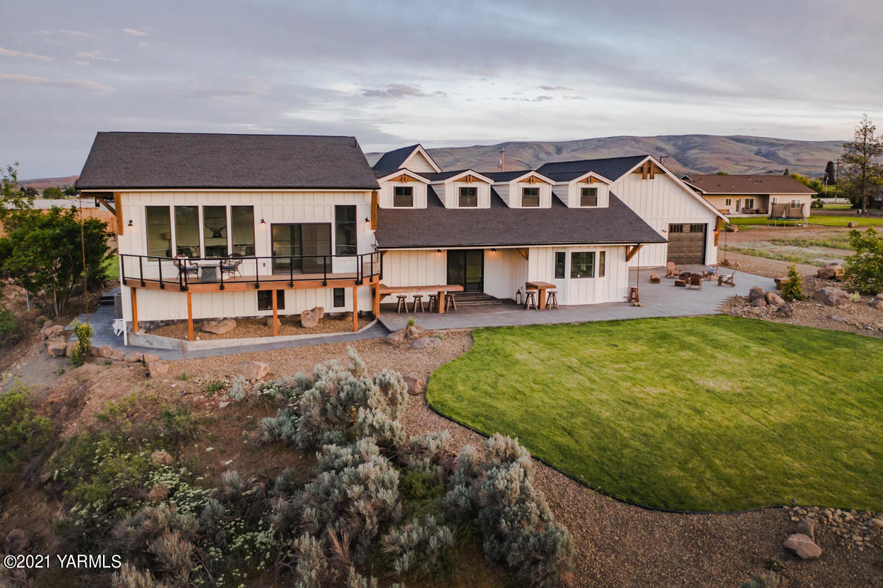 491 Elliott Road Cowiche, WA 98923 - Photo 45 of 49 a view of a house with sitting area and swimming pool