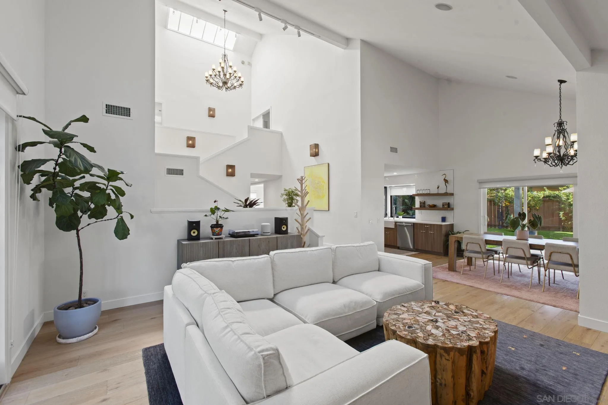 3942 Avenida Brisa Rancho Santa Fe, CA 92091 - Photo 15 of 47 a living room with furniture a chandelier and a table