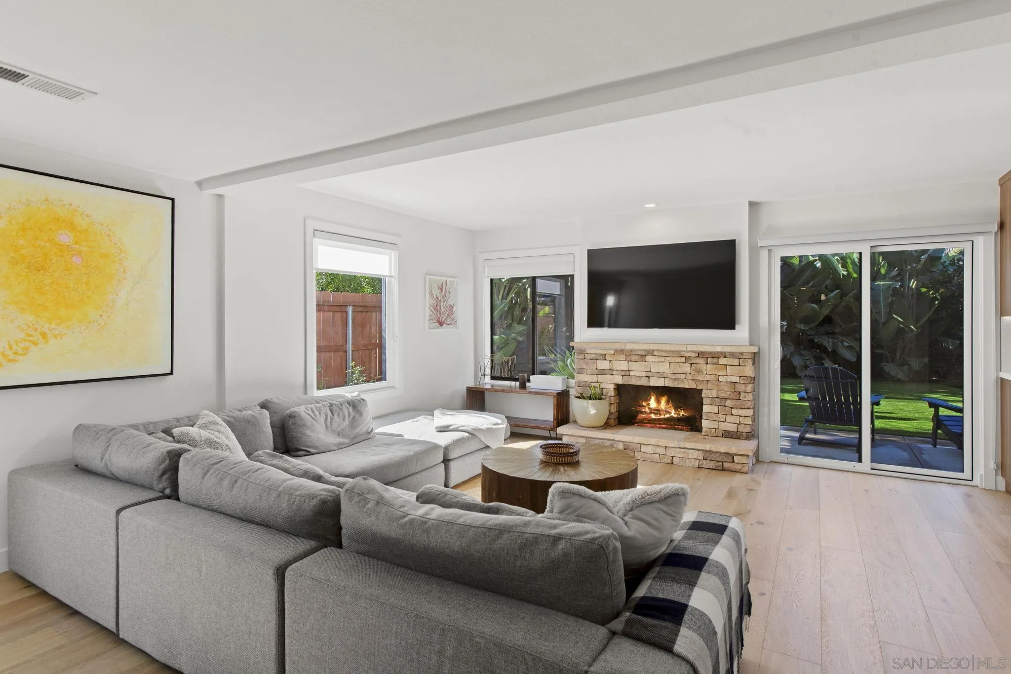 3942 Avenida Brisa Rancho Santa Fe, CA 92091 - Photo 19 of 47 a living room with fireplace furniture and a flat screen tv