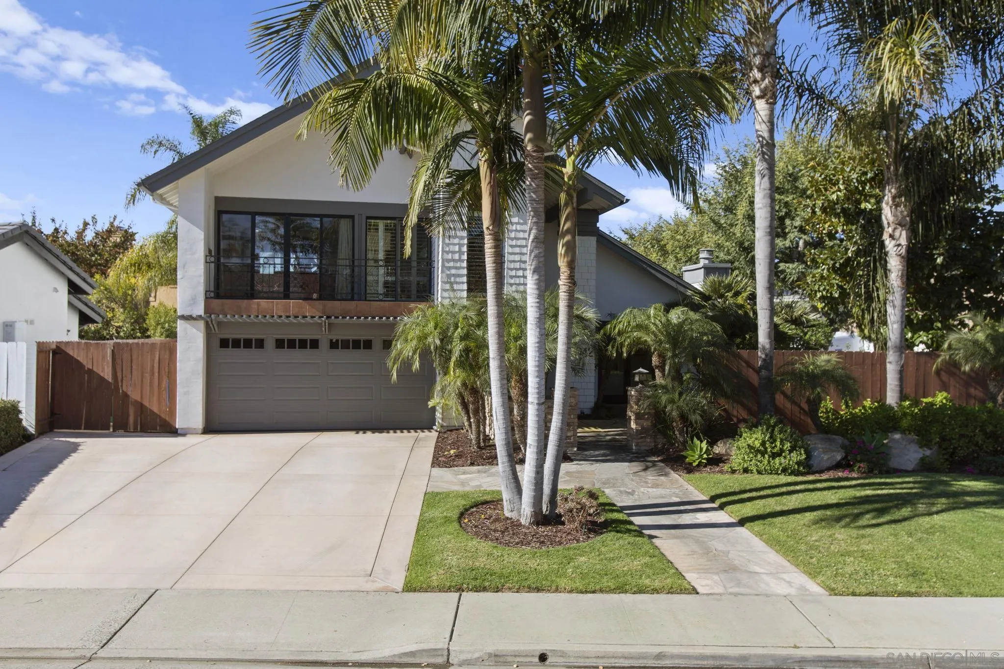 3942 Avenida Brisa Rancho Santa Fe, CA 92091 - Photo 2 of 47 a front view of a house with a garden