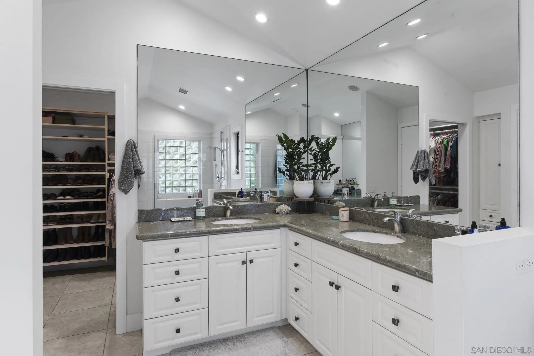 3942 Avenida Brisa Rancho Santa Fe, CA 92091 - Photo 30 of 47 a bathroom with a granite countertop sink mirror and double