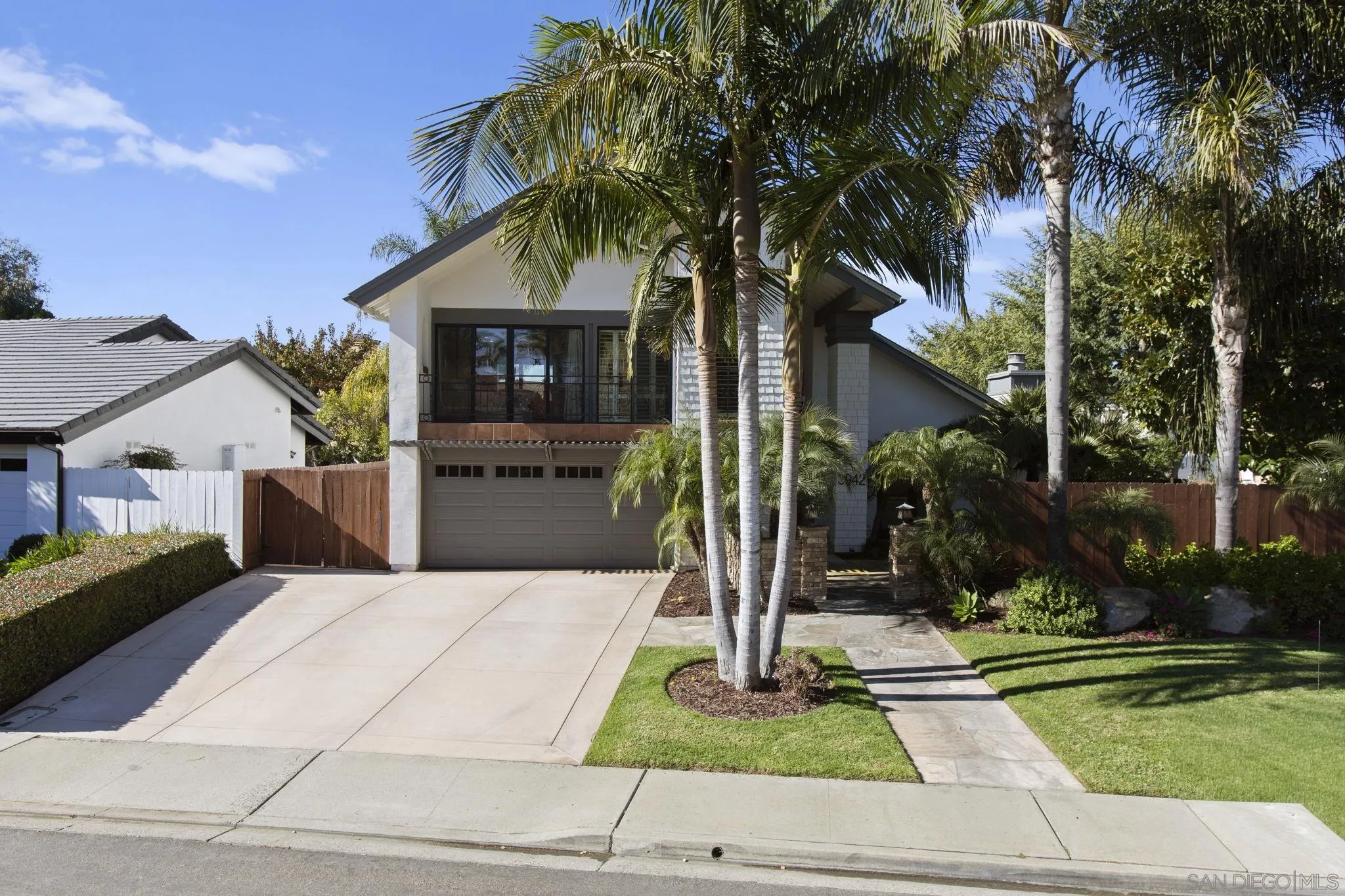 3942 Avenida Brisa Rancho Santa Fe, CA 92091 - Photo 3 of 47 a front view of a house with a yard