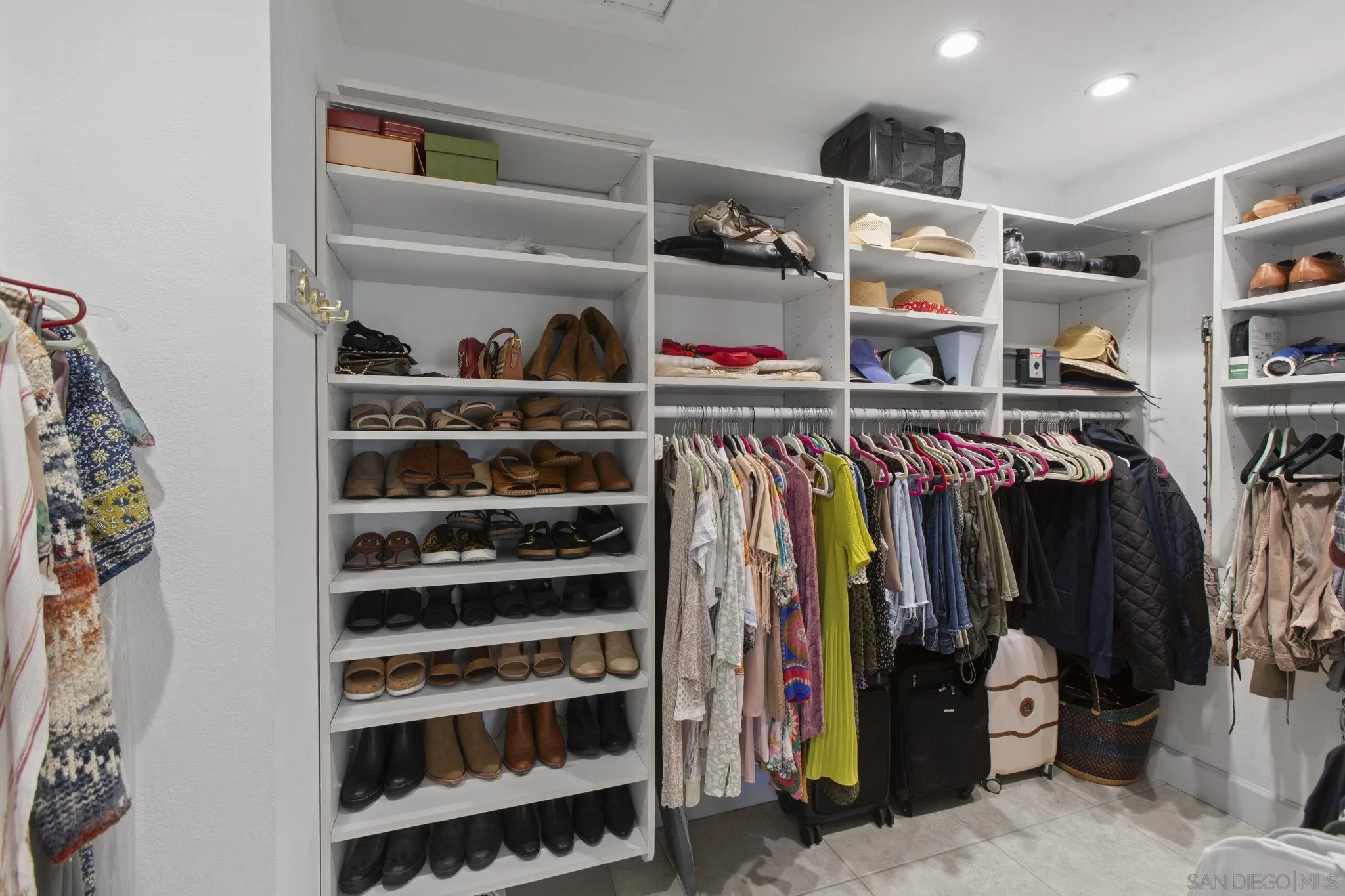 3942 Avenida Brisa Rancho Santa Fe, CA 92091 - Photo 31 of 47 a view of walk in closet with clothes and shoes