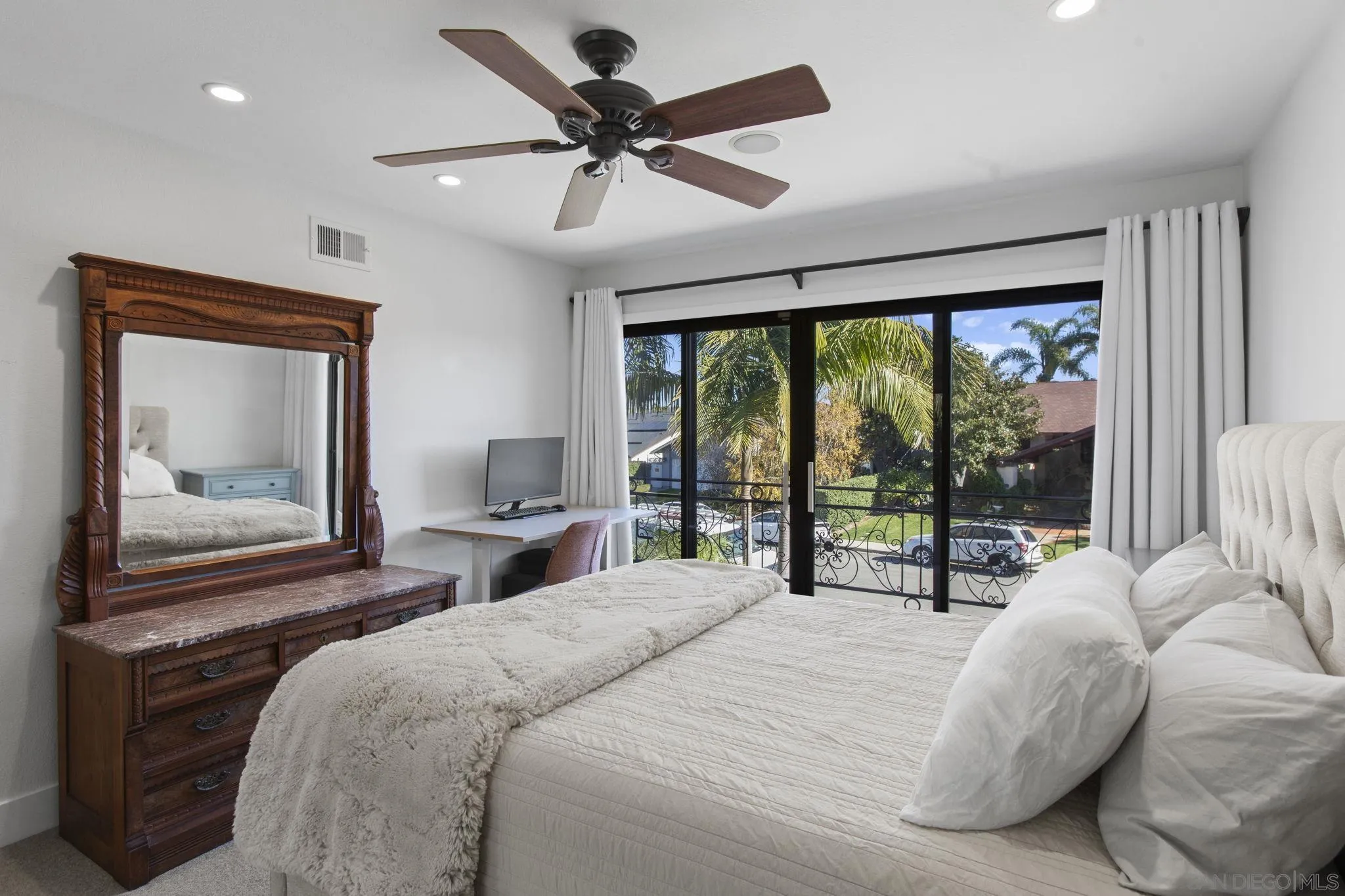 3942 Avenida Brisa Rancho Santa Fe, CA 92091 - Photo 39 of 47 a bedroom with a large bed and a large window