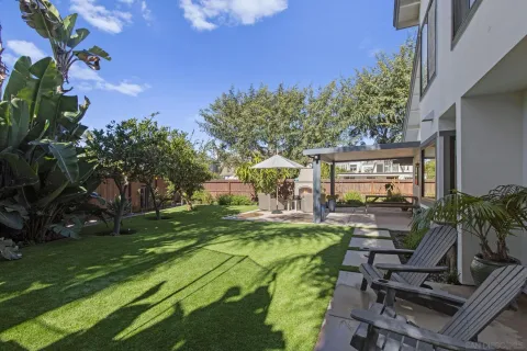 a view of a chairs and table in the patio
