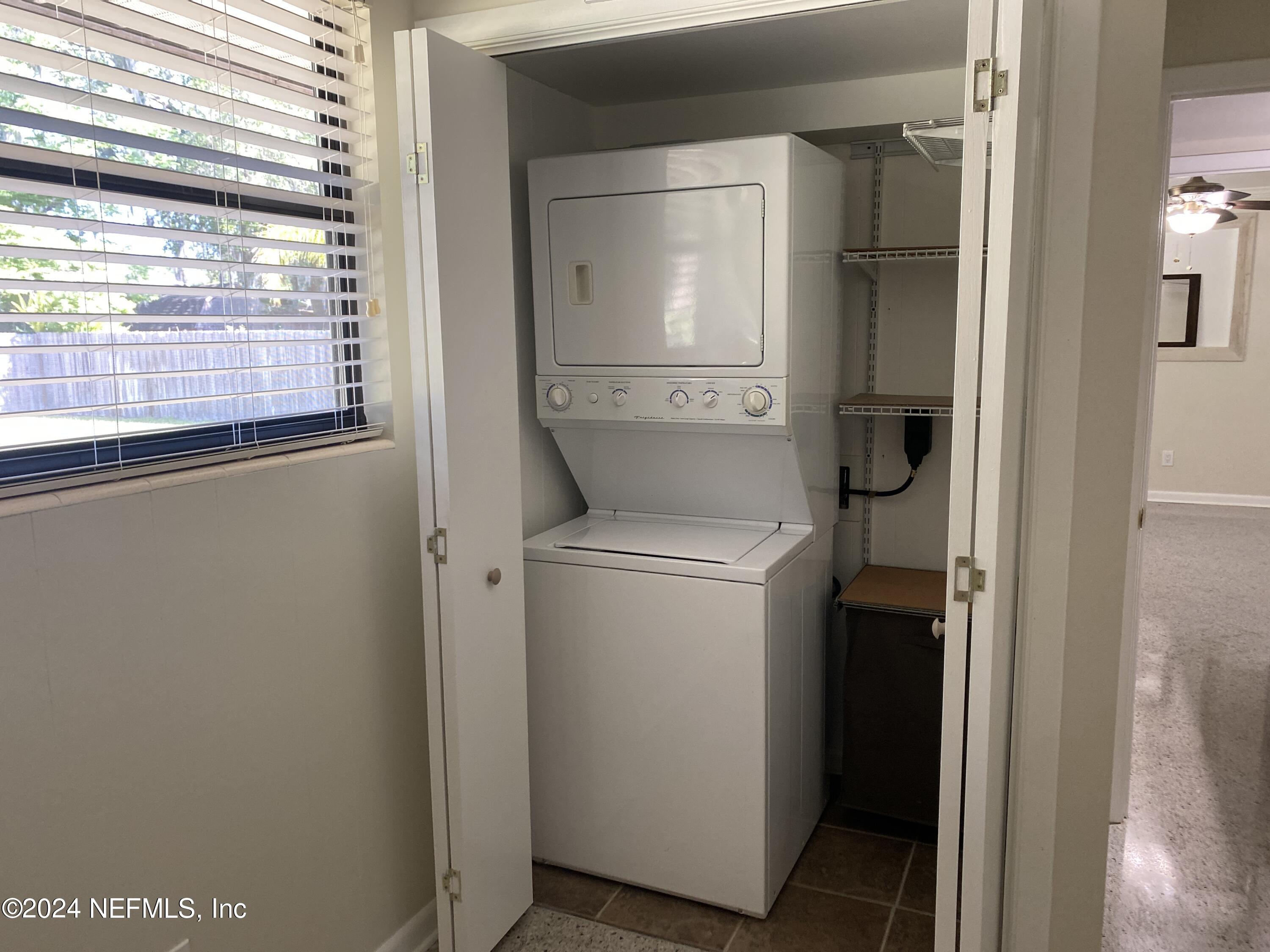 104 St Elmo Road Green Cove Springs, FL 32043 - Photo 12 of 13 Bedroom 2 with washer and dryer.