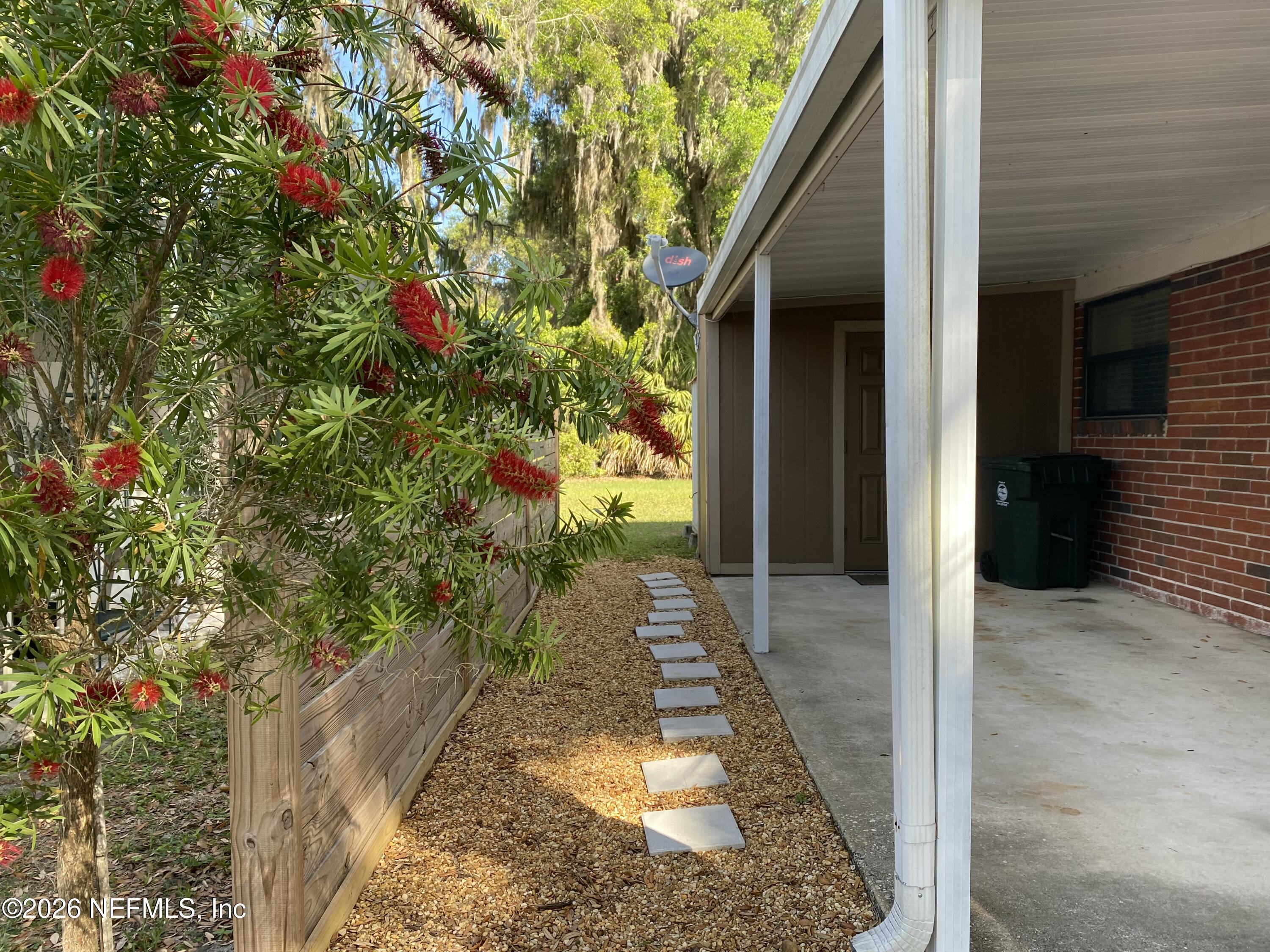 104 St Elmo Road Green Cove Springs, FL 32043 - Photo 21 of 24 a view of a pathway both side of the house