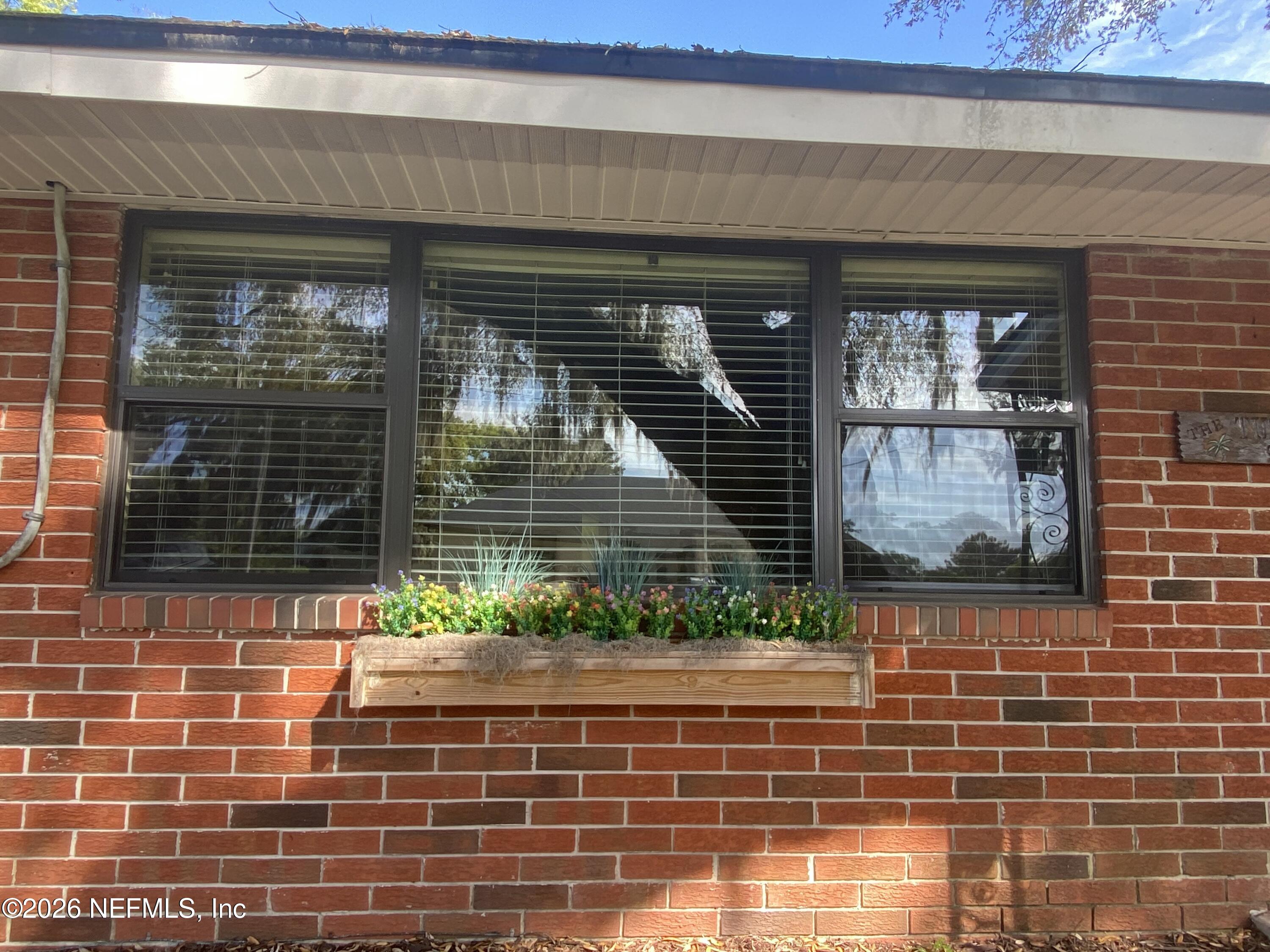 104 St Elmo Road Green Cove Springs, FL 32043 - Photo 3 of 24 a front view of a house with a yard