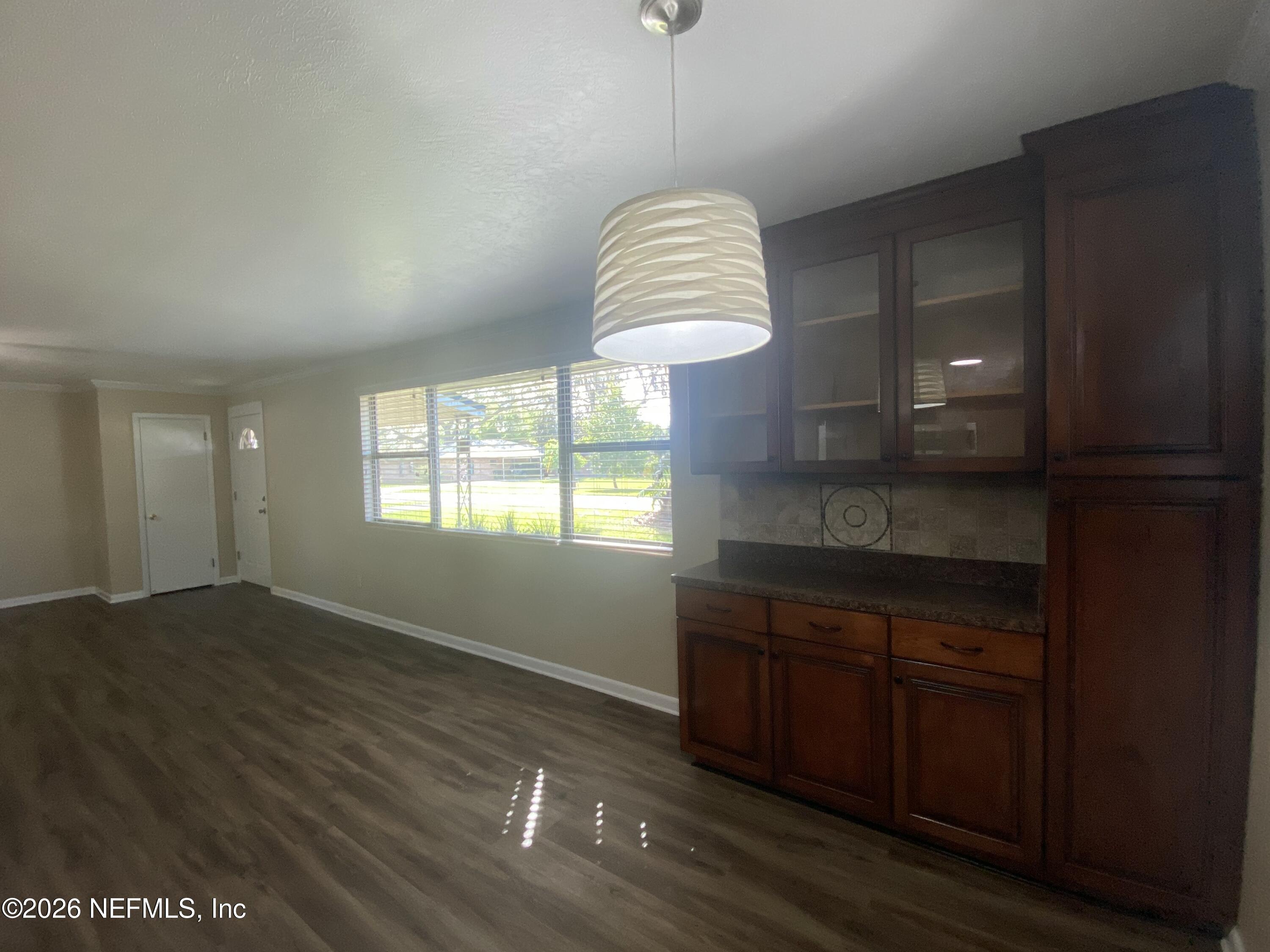 104 St Elmo Road Green Cove Springs, FL 32043 - Photo 8 of 24 a kitchen with a sink cabinets and a window