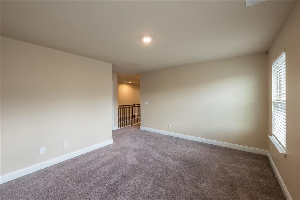 12172 Flannery Lane Hampton, GA 30228 - Photo 26 of 31 an empty room with windows and fireplace