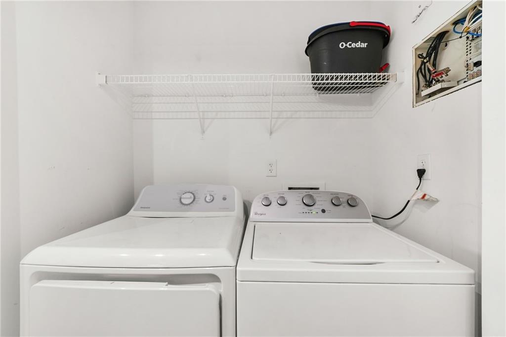 3338 Peachtree Road Northeast, Unit 3302 Atlanta, GA 30326 - Photo 18 of 42 a utility room with dryer and washer