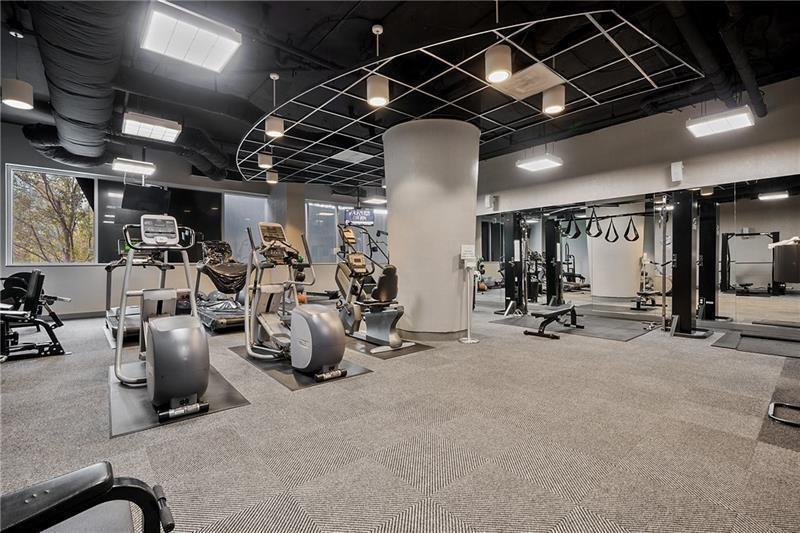 3338 Peachtree Road Northeast, Unit 3302 Atlanta, GA 30326 - Photo 29 of 42 a view of a room with gym equipment