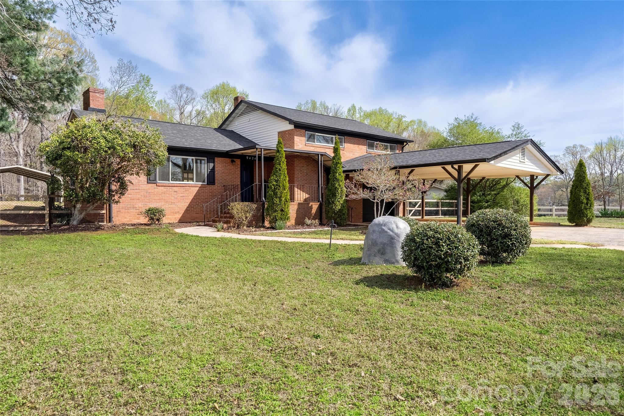 9424 Pembroke Road Huntersville, NC 28078 - Photo 1 of 39 a view of a house with backyard and porch